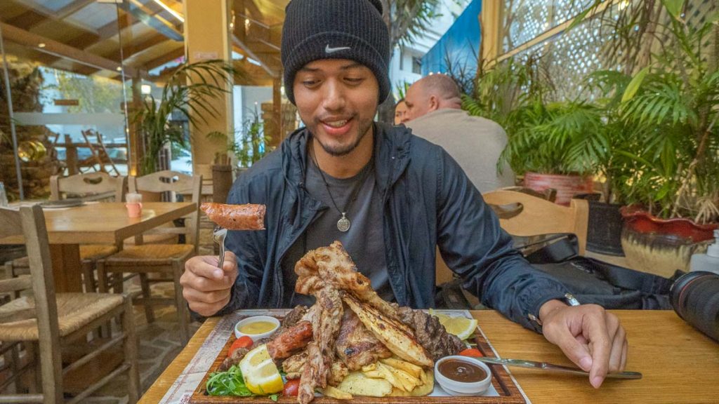 Man Eating at MIRONI Greek Restaurant - Things to do in Greece