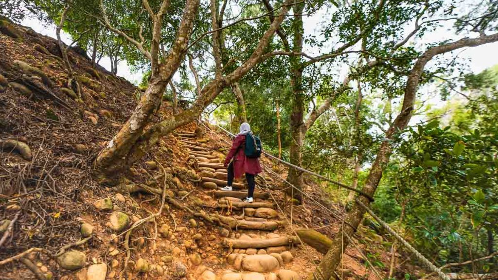 girl going up the steps while hiking huoyan shan - things to do in taiwan