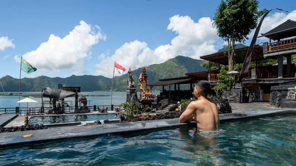 Man chilling at Batur Natural Hot Spring - Things to do in Batur