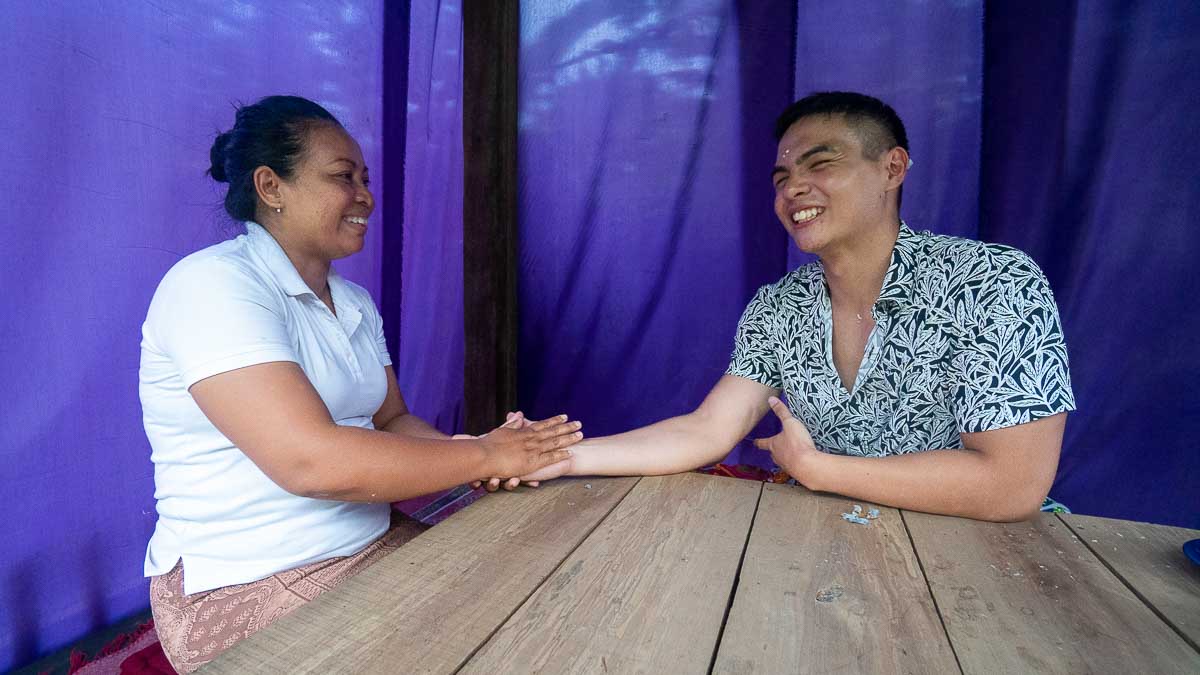 Man getting palm read at Puri Pandawa Palm Reading - Wellness tour in Ubud