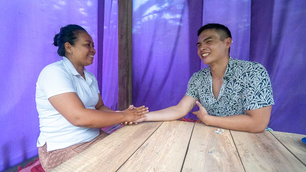 Man getting palm read at Puri Pandawa Palm Reading - Wellness tour in Ubud