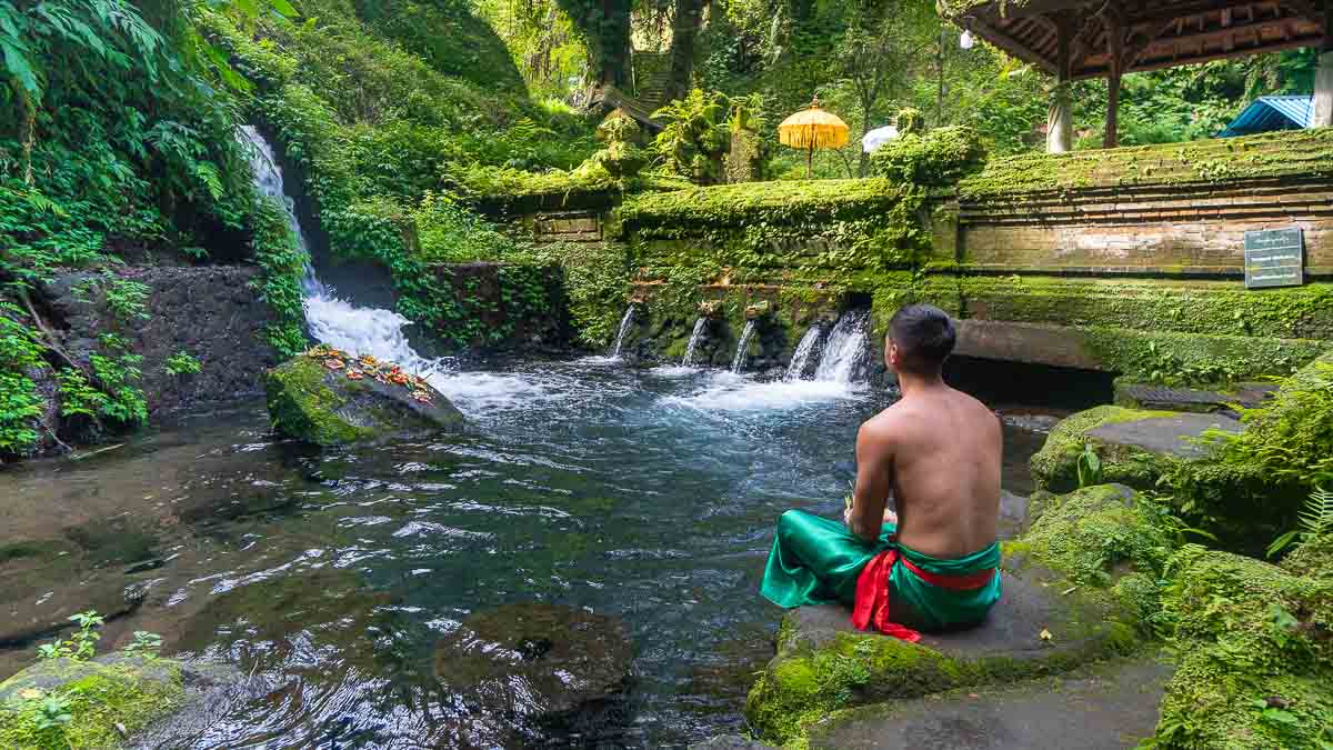 Man Meditating at Pura Meninging Temple - Wellness tour in Ubud