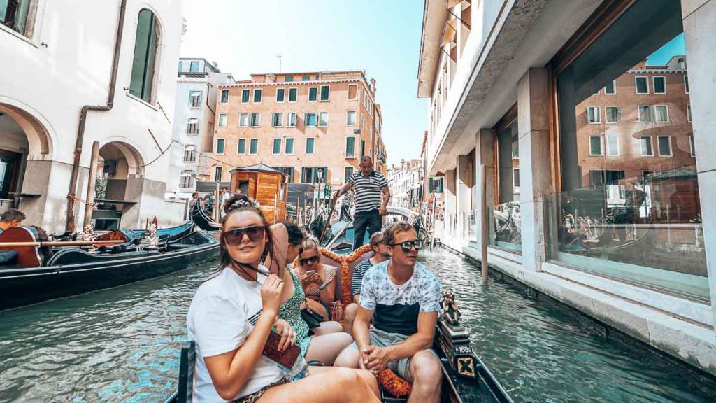 Friends on a gondola ride in Venice - Europe Itineraries