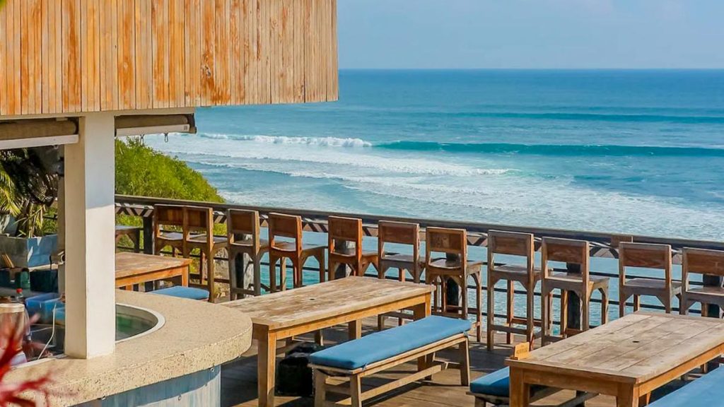 Outdoor seating facing surf breaks at Single Fin, Uluwatu, Bali — Where to eat vegetarian in Bali