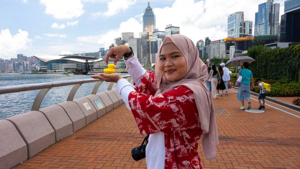 a muslim girl posing with the double ducks at central pier - hong kong itinerary