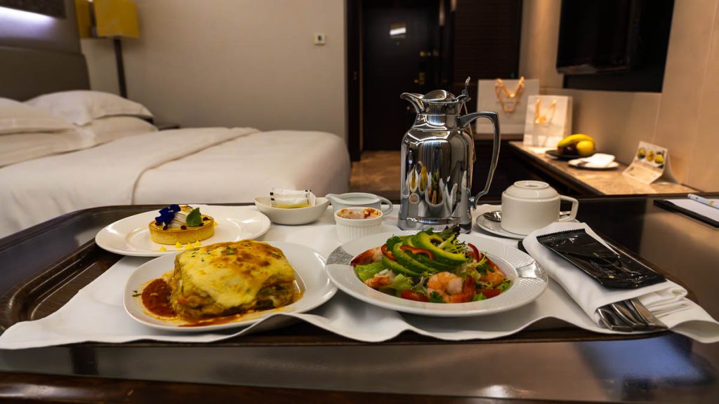 vegetarian lasagne with salad and a lemon tart for halal in room dining in intercontinental grand stanford - hong kong itinerary