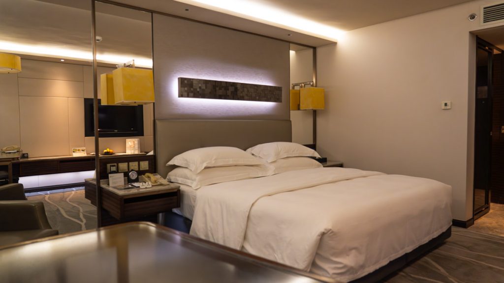 a king sized bed in the intercontinental grand stanford hotel - hong kong itinerary