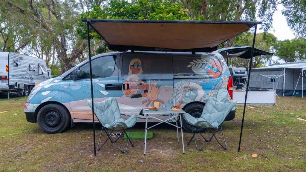 camper van with shelter opened