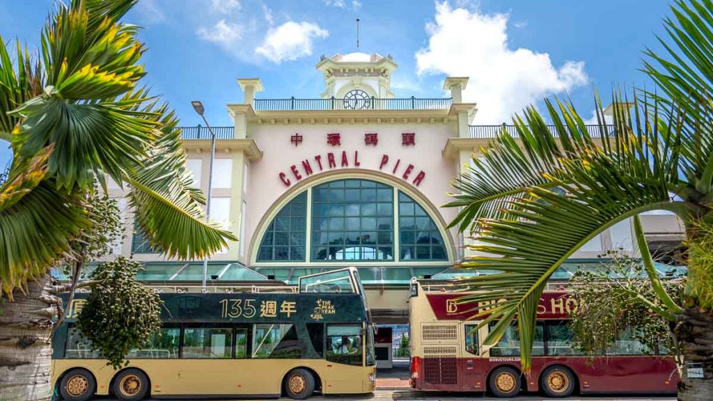 tourist buses in front of central pier - hong kong itinerary