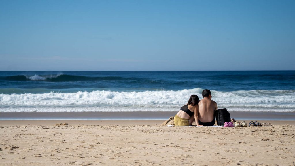 Couple chilling at Surfers Paradise Beach