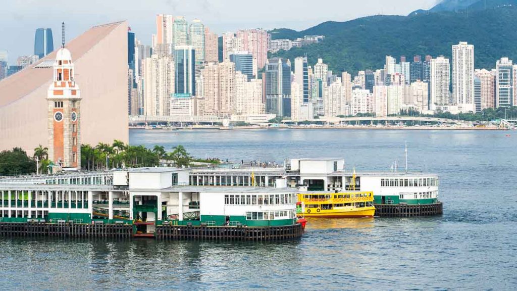 ferries transporting commuters at victoria harbour - hong kong itinerary