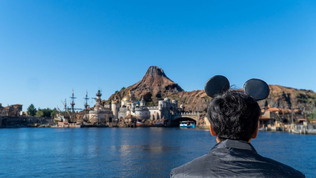 Man looking at the the Journey to the Centre of the Earth attraction at Tokyo Disneysea - Japan theme aprks
