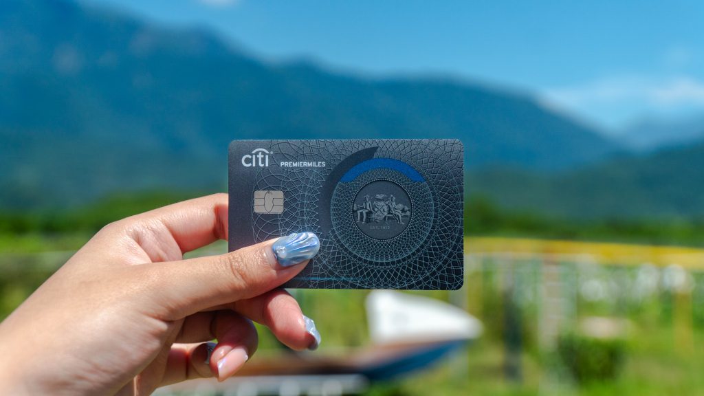 Girl holding the Citi Premiermiles Card - Adventures in Taiwan