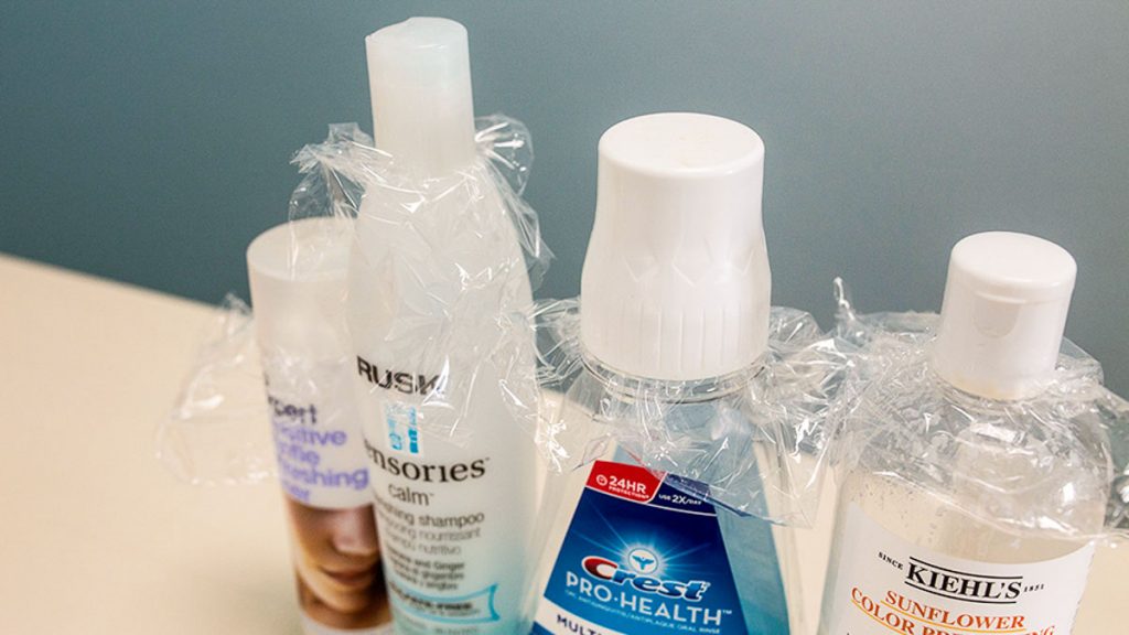 Plastic Wrap on Bottles - Travel Hacks