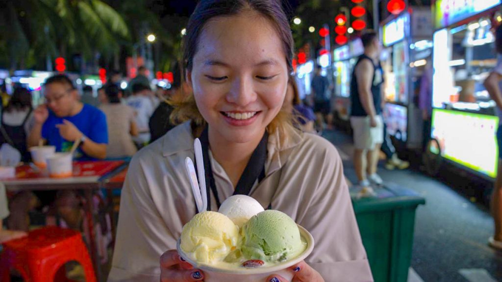 Girl Eating Qingbuliang - Hainan Itinerary