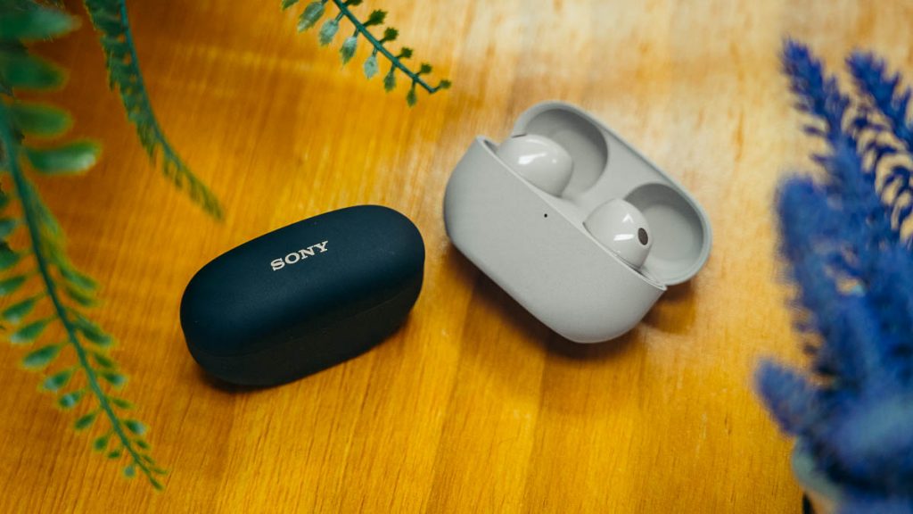 Sony WF-1000XM5 Flatlay of Black and Grey Headphones - Sony WF-1000XM5 Review