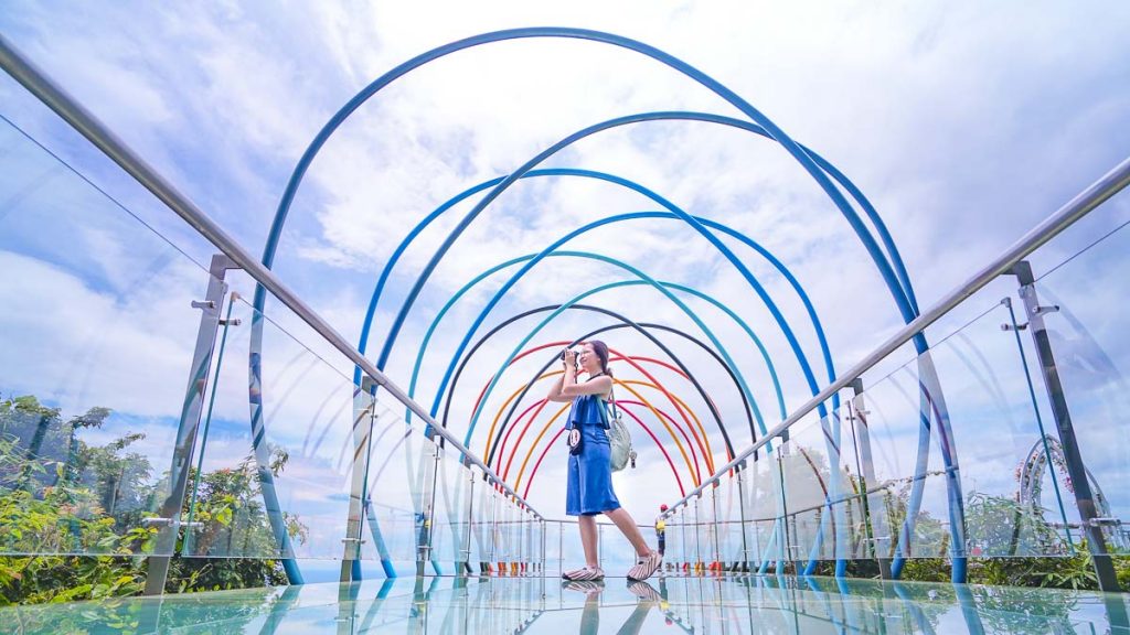 Girl on a glass bridge in Hainan Island - Things to see in Hainan