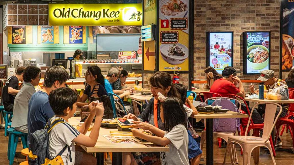 People eating at seated dining of Ang Mo Kio Fairprice Old Chang Kee - Things To Do In Ang Mo Kio