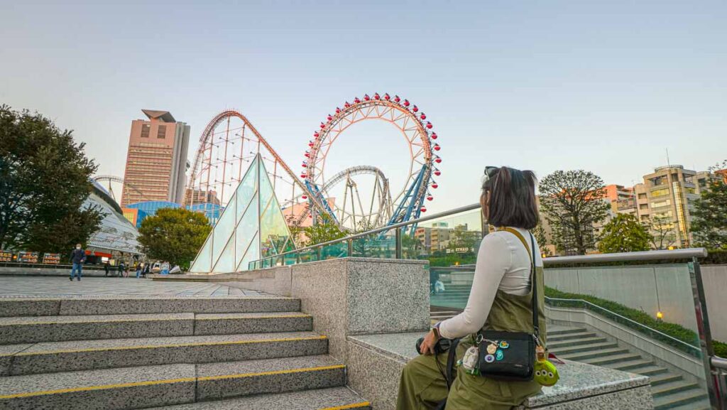 Girl sitting at Entrance Tokyo Dome City - Non-Touristy Tokyo