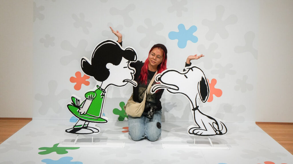 Girl between two Snoopy Standees at  Photo Op at Snoopy Museum -  Non-Touristy Tokyo