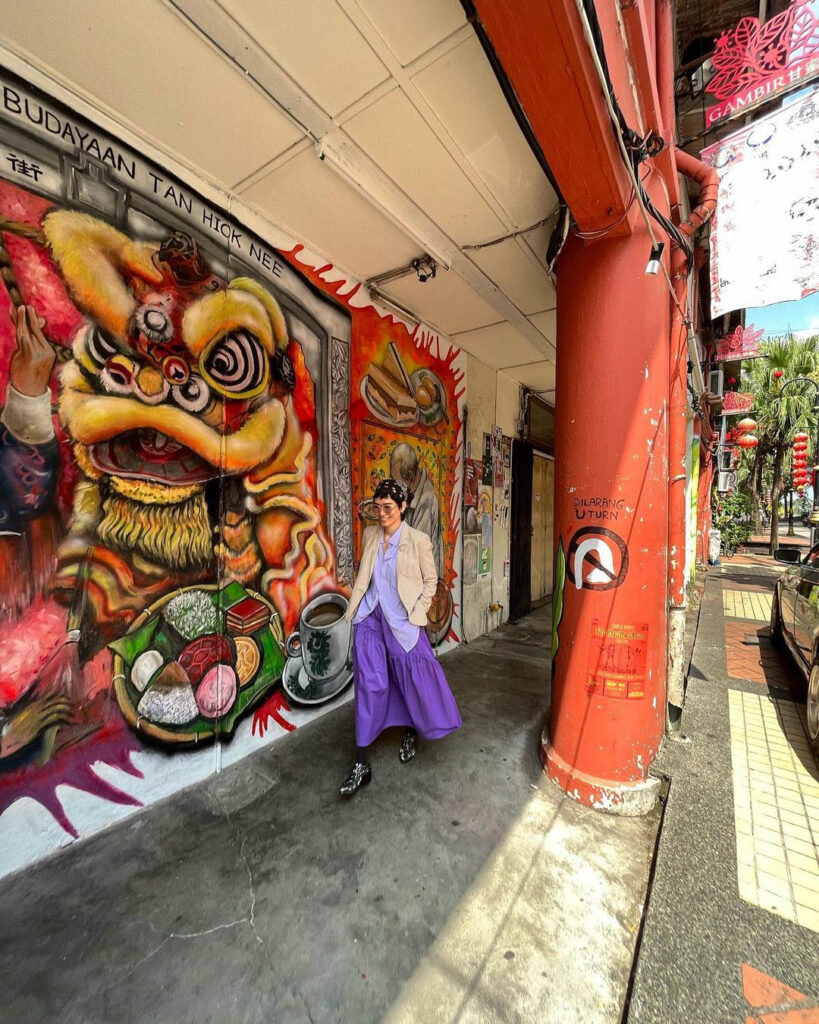 Girl posing at Jalan Tan Hiok Nee street art - JB Day Trip