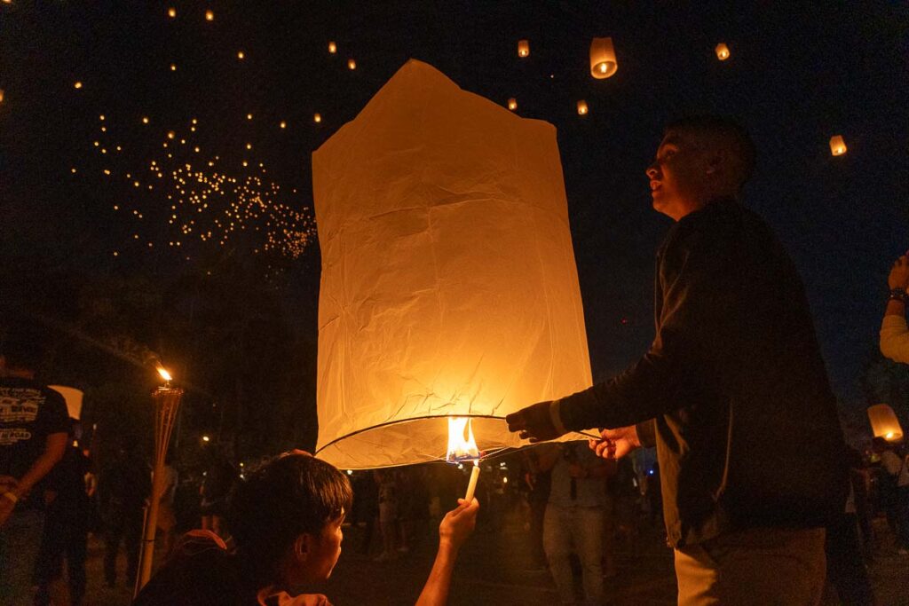 Lighting up a Lantern at Loy Kratong Festival