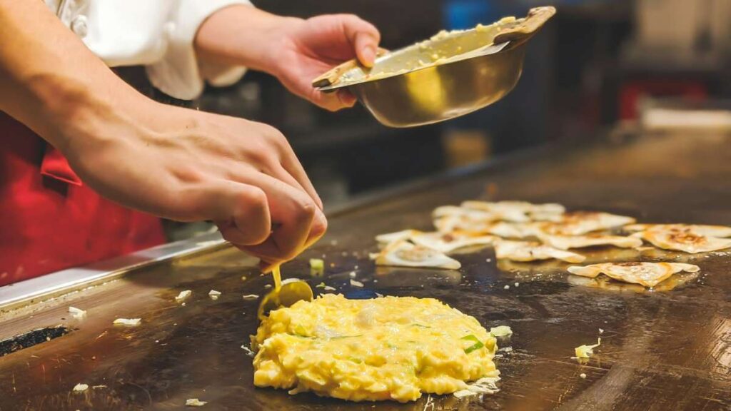 Chef Cooking Okonomiyaki Dish - Tokyo vs Osaka