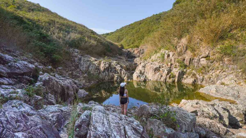 Girl standing in middle of Sai Kung Rock Pools