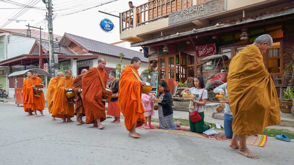 People Giving Monk Alms - Guide to Songkran