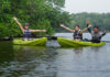 People posing on Kayaks in Lebam River