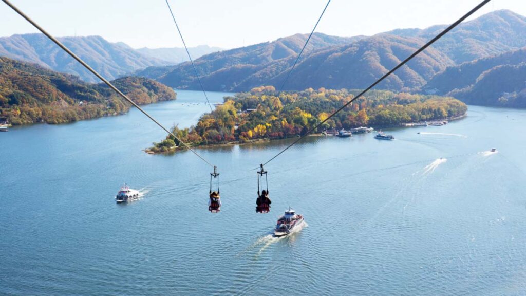 Two people taking the zipline into Nami Island - Nami Island Day Trip