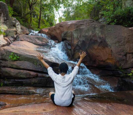 Boy In front of Iron waterfall - Things to do in penang