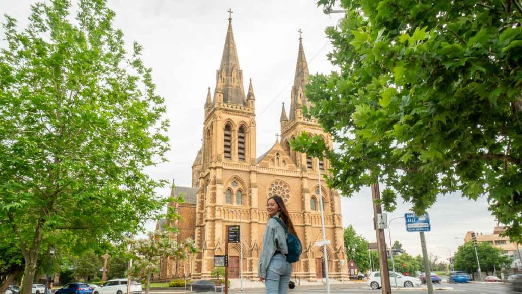 Woman visiting St Peter's Cathedral Adelaide - South Australia WInter Attractions