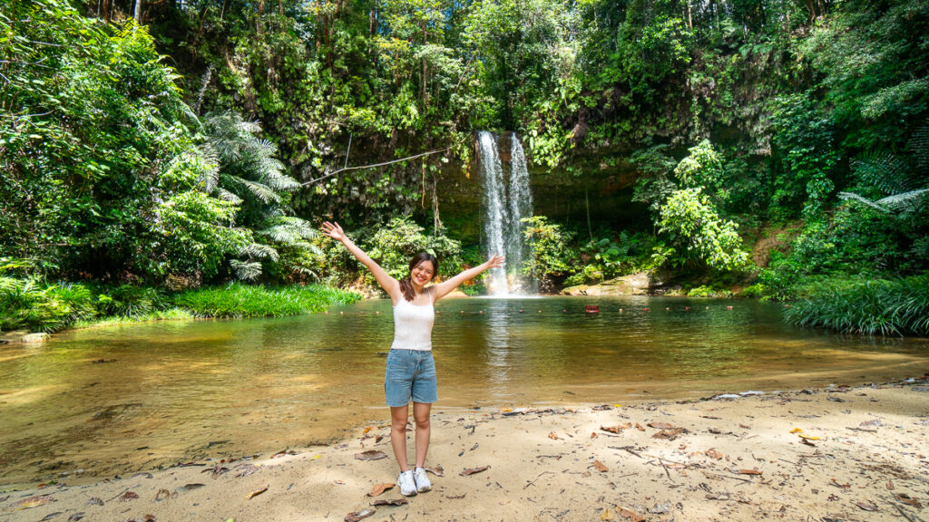 Woman at Latak waterfall in Lambir Hills National Park - Sarawak guide