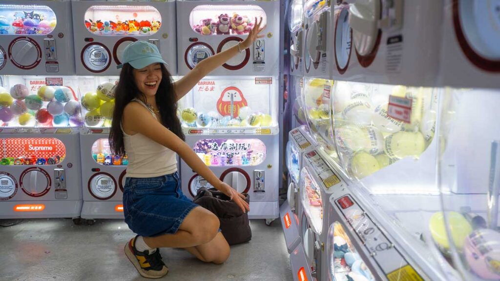 Girl kneeling next to Gachapon machines DARUMA GACHAPON JB City Square - Jalan Wong Ah Fook shops
