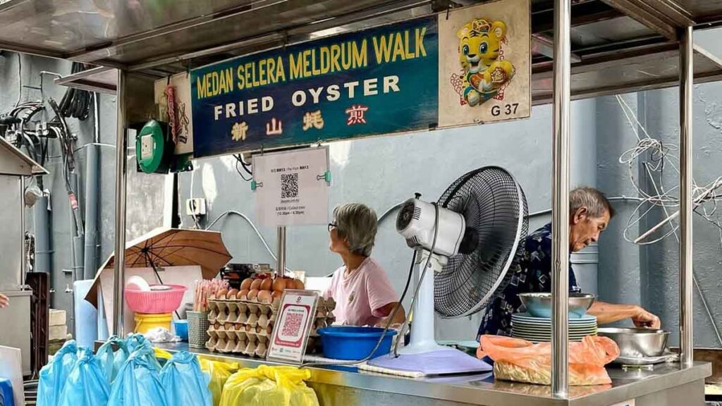Elderly couple manning their oyster omelette stall at Meldrum Walk Street Foods - Things to eat in Jalan Wong Ah Fook
