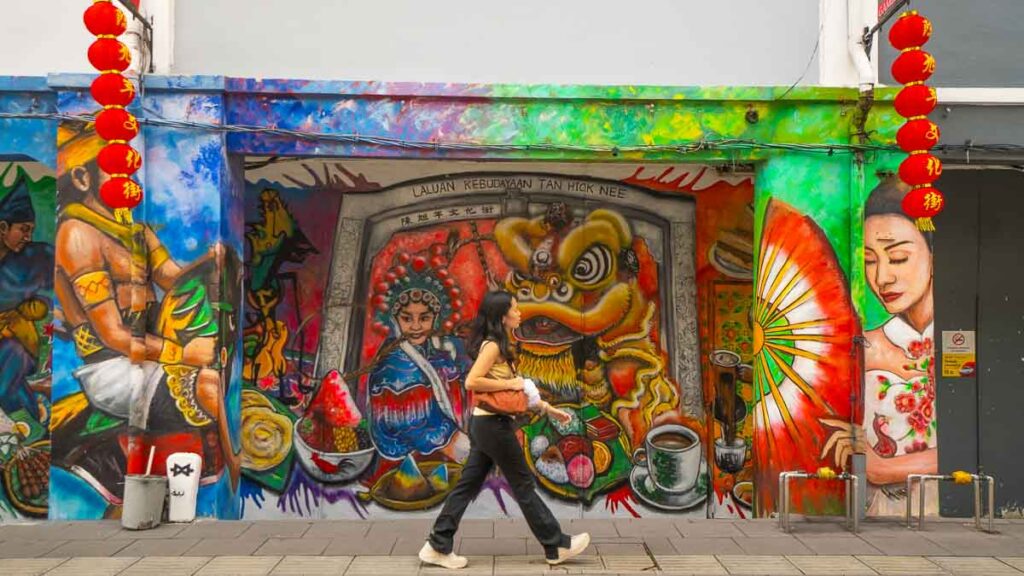 Girl walking before mural - Things to see in Jalan Tan Hiok Nee