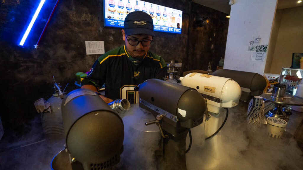 Staff pouring liquid nitrogen to make ice cream at TIP Ice Cream Project - Things to eat in Jalan Tan Hiok Nee