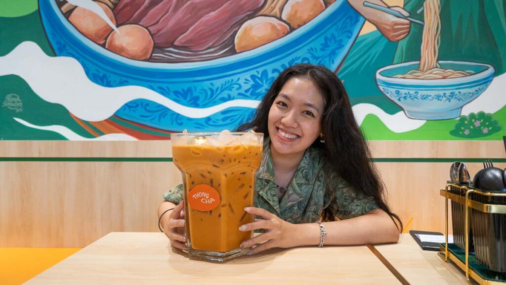 Girl posing with 1.5L milk tea at Thong Bowl - Skudai Food Guide
