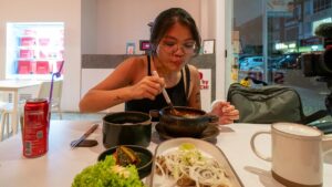 Tracey eating at SUP by Super Kimchi - Things to do in Sutera Mall JB