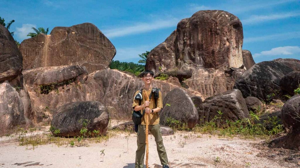 Male hiker Jensen at the big rocks - JB hiking guide Kangkar Pulai Blue Lake