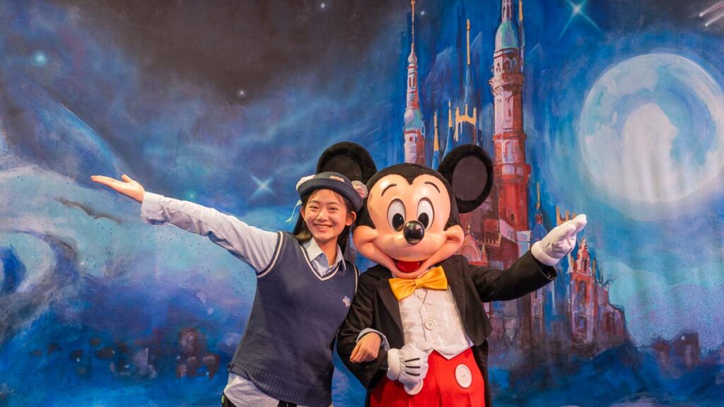 Taukee posing with Mickey Mouse - Shanghai Disneyland