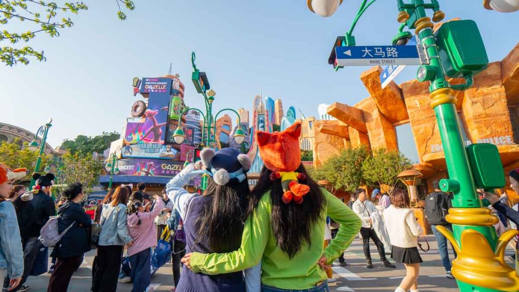 Taukee and Celeste posing in front of Zootopia - Shanghai Disneyland