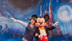 Taukee posing with Mickey Mouse - Shanghai Disneyland