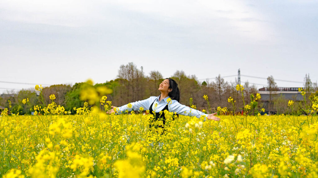 Girl standing in the flower field at Guangfulin Cultural Relics Park - Hidden gems in Shanghai