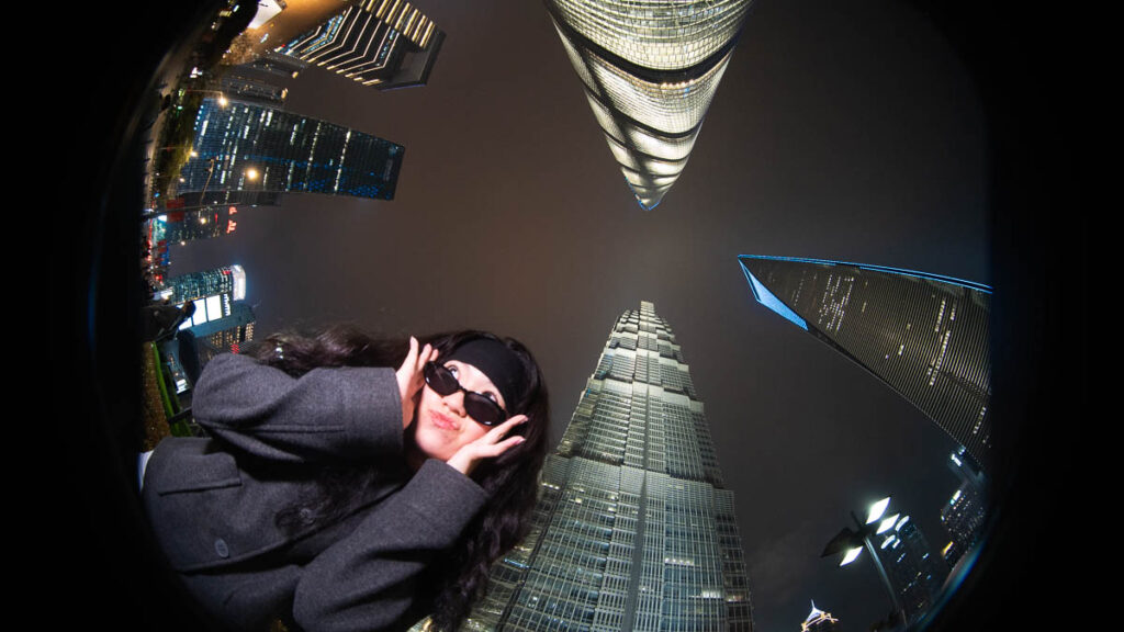 Celeste posing with the three buildings of Lujiazui - China itinerary