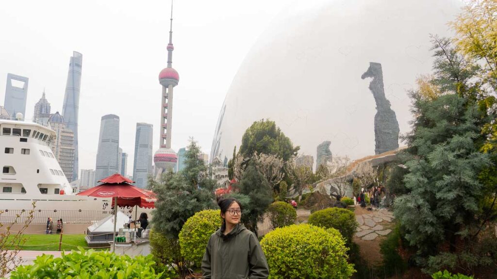 Girl posing with the egg at North bund Greenland - What to do in Shanghai