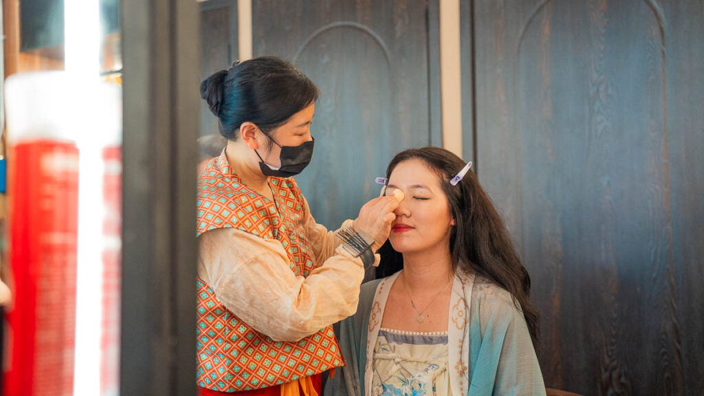 Xuyan staff helping Celeste to put on her makeup for dinner - Xuyan dinner