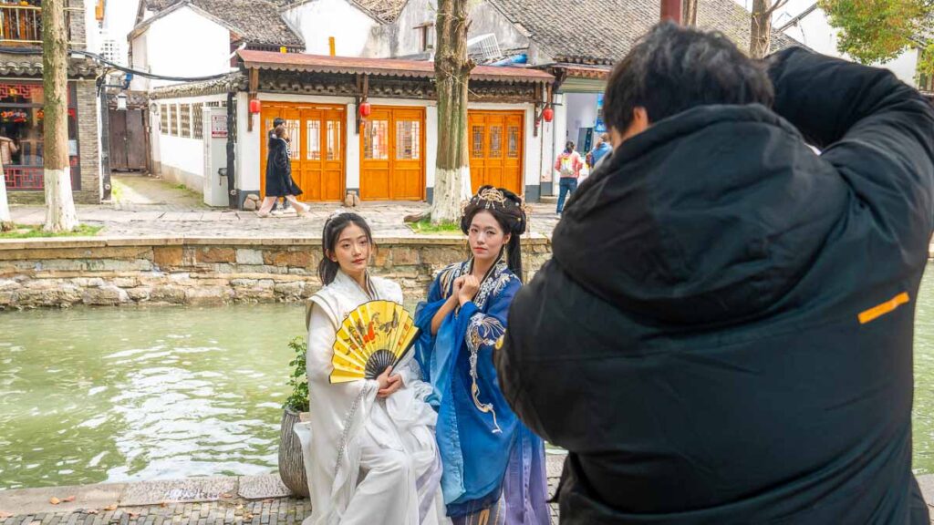 Two girls posing for their photographer in their hanfu at Zhujiajiao Water Town - Zhujiajiao Hanfu photoshoot