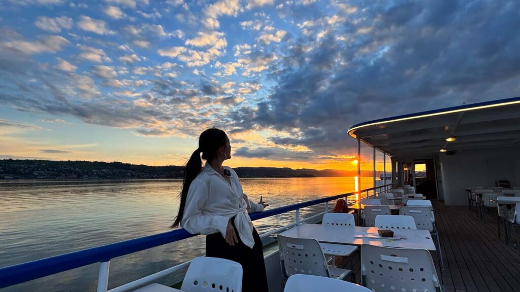 Taukee looking at the sunset on the boat cruise to Zurich - Switzerland Guide